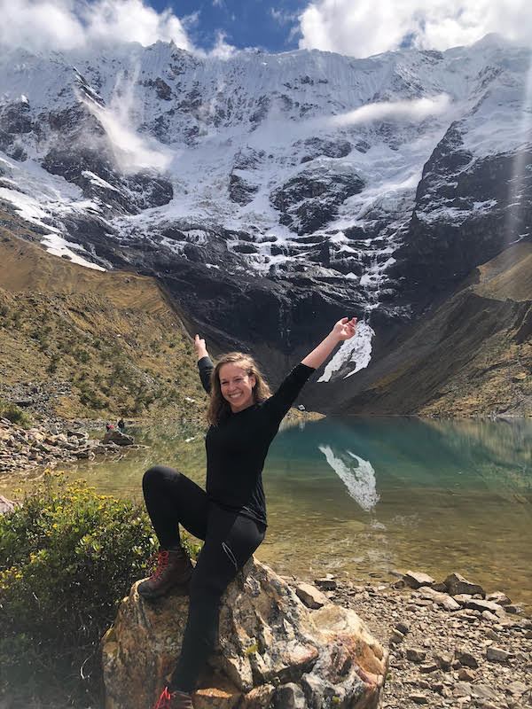Emilie O'Connor in front of a mountain lake
