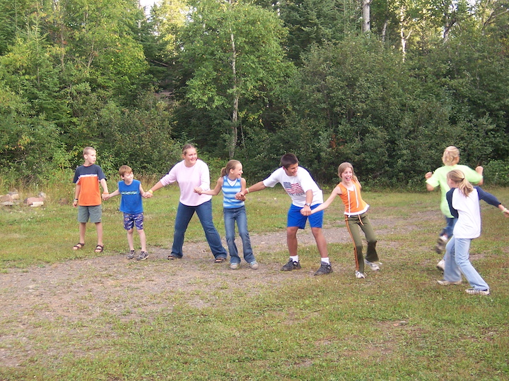 a group of kids playing red rover