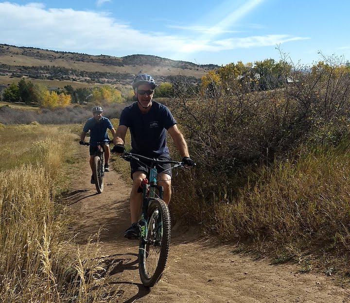 two men mountain biking