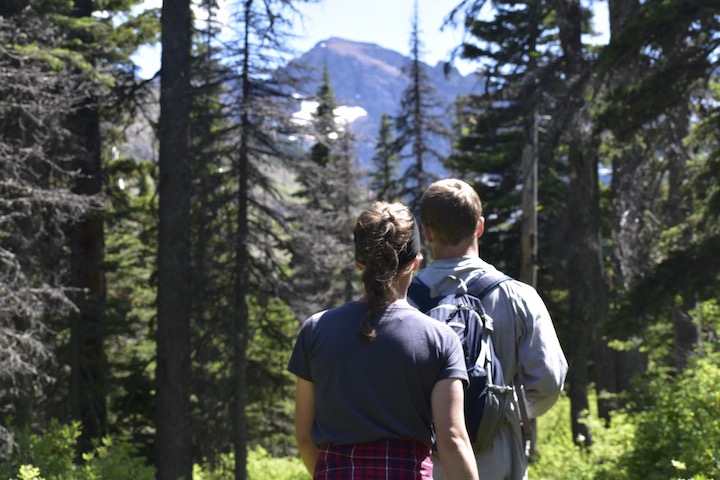 woman and man hiking in the mountain forest
