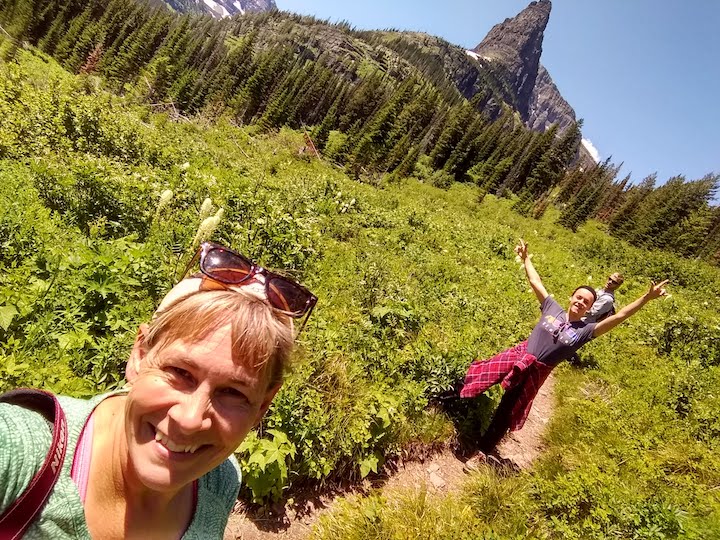 three people hiking in the mountains
