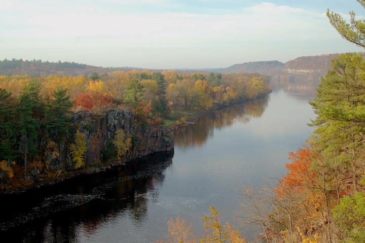 the st. croix river and surrounding trees in the fall