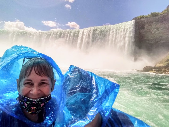 my sister and I on a boat tour, Horseshoe Falls behind us