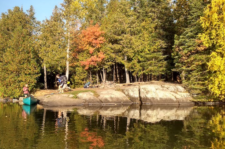 packing up the canoe campsite