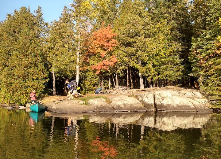 breaking camp on a canoe trip