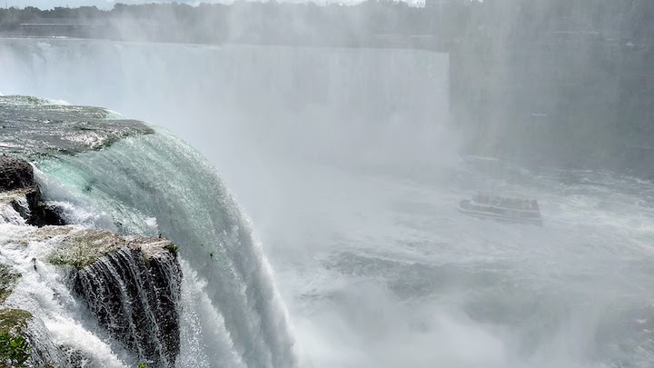 Horseshoe Falls, Niagara River, from the American side (a river boat in the mist down below)