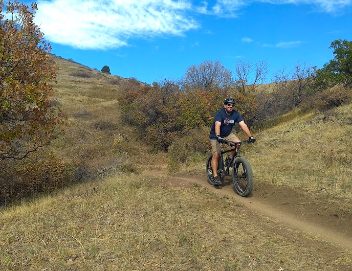 man on a mountain bike in hilly country