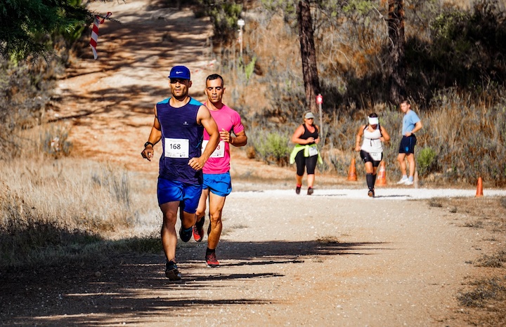 several men and women in a running race