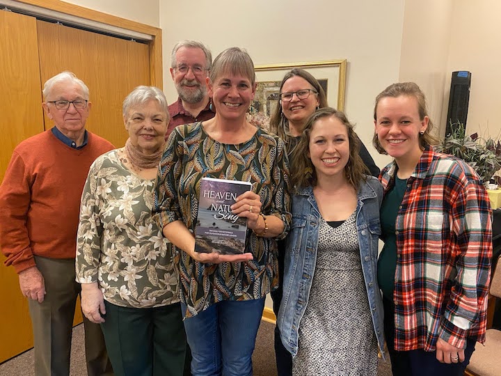 a group of people at the book signing