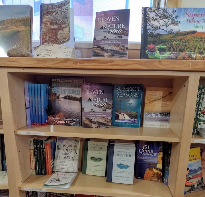 "Heaven and Nature Sing" paperback books for sale in a retail store