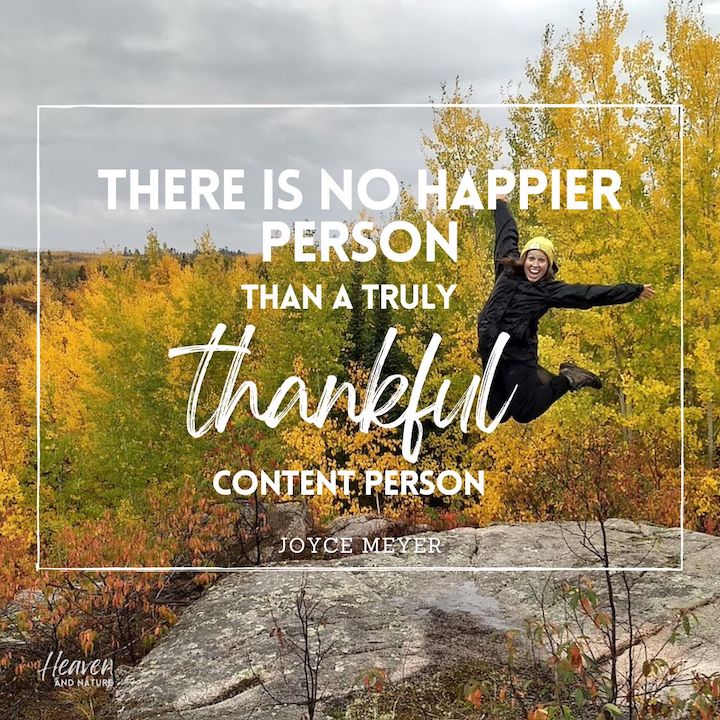 "There is no happier person than a truly thankful content person" with image of young woman in black leaping for joy among fall color